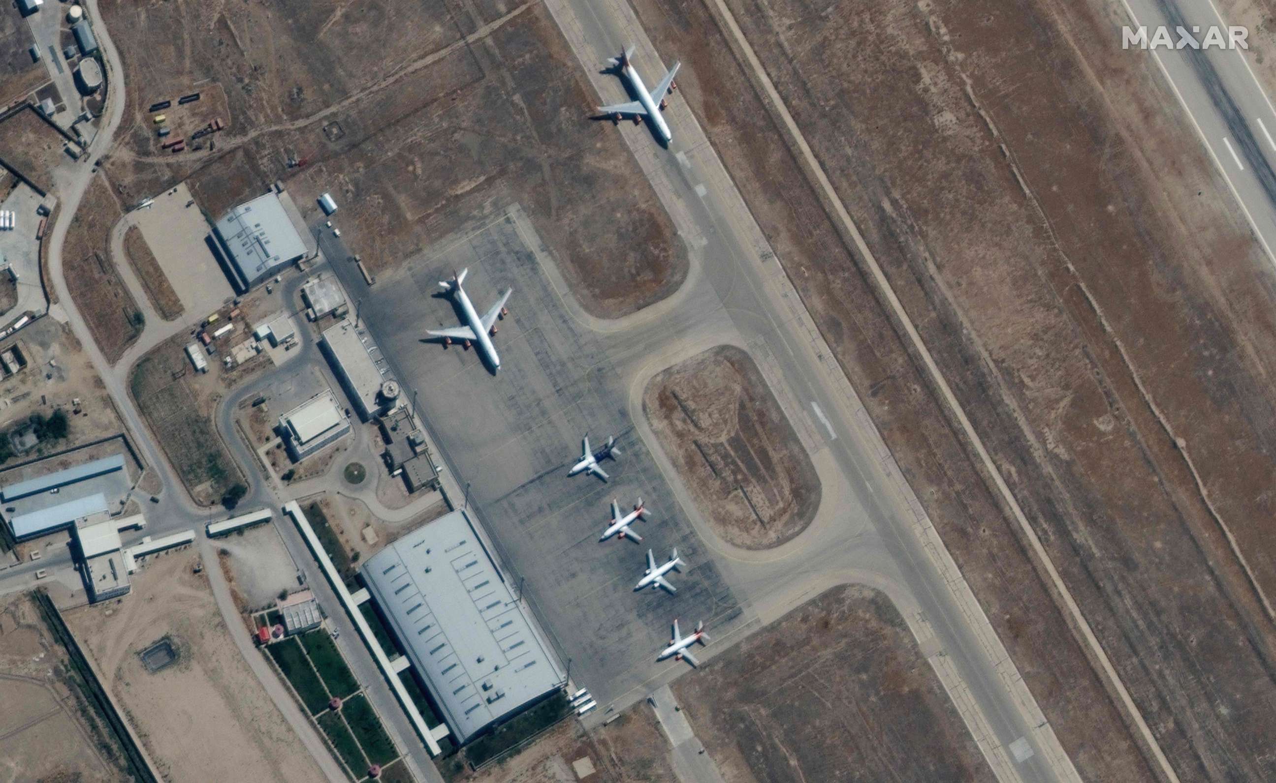 PHOTO: This handout satellite image released by Maxar Technologies shows grounded commercial planes at the the Mazar-i-Sharif airport in northern Afghanistan on Sept. 3, 2021.