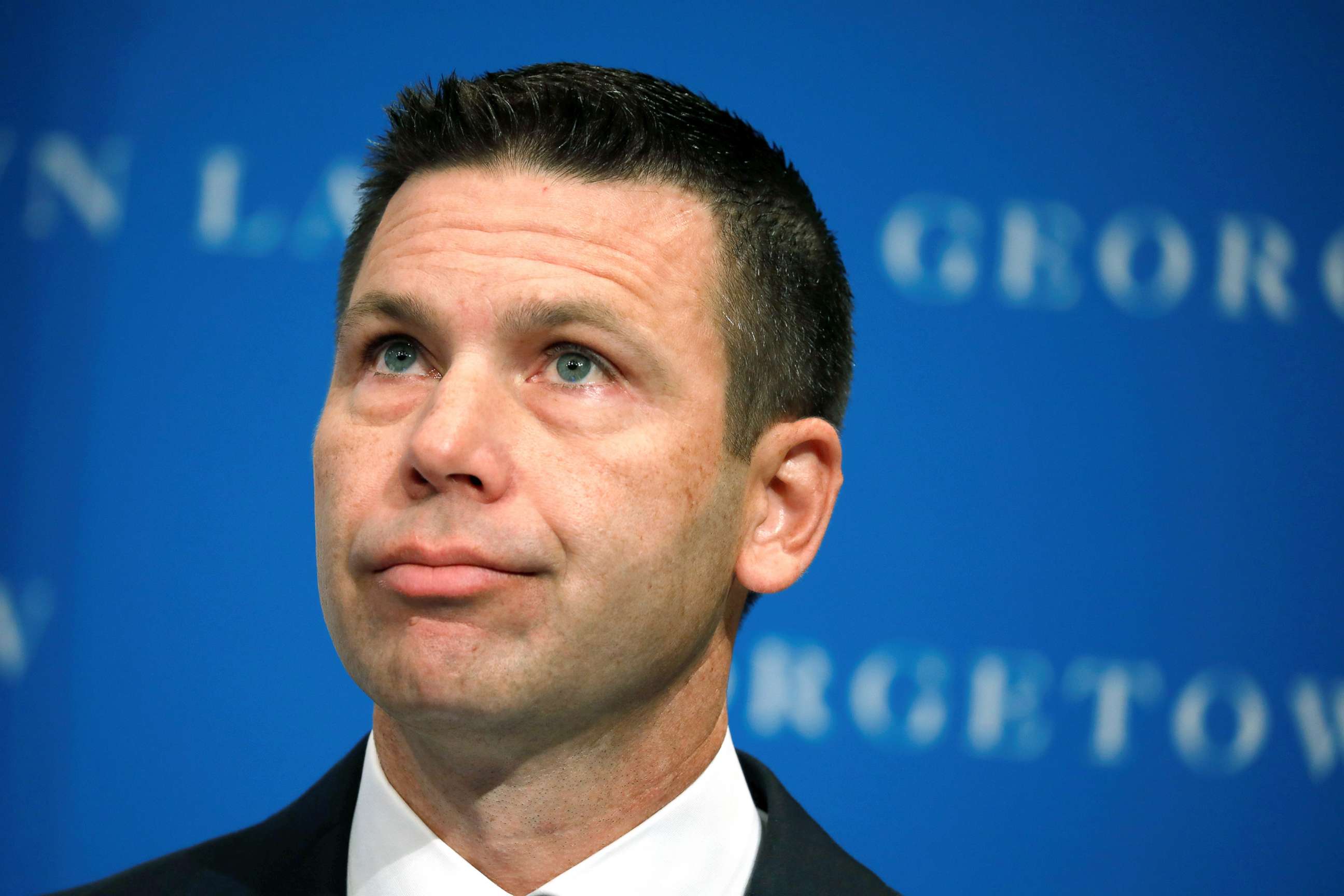 PHOTO: Acting Department of Homeland Security (DHS) Secretary Kevin McAleenan reacts while demonstrators interrupt his remarks at the Migration Policy Institute annual Immigration Law and Policy Conference in Washington D.C., Oct. 7, 2019.