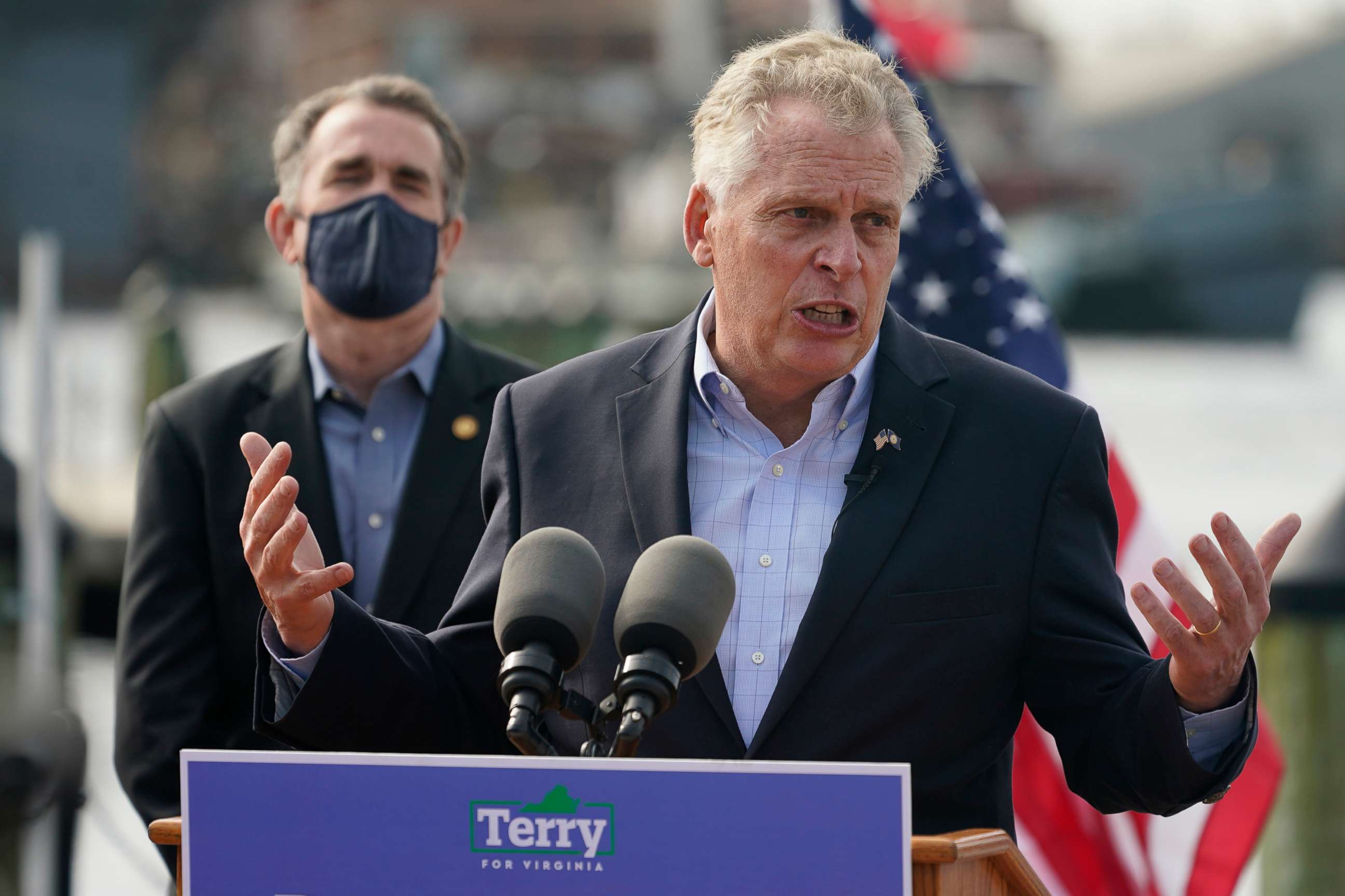 PHOTO: Former Virginia Gov. Terry McAuliffe, right, gestures during a news conference with Virginia Gov. Ralph Northam, left, at Waterside in Norfolk, Va., April 8, 2021.