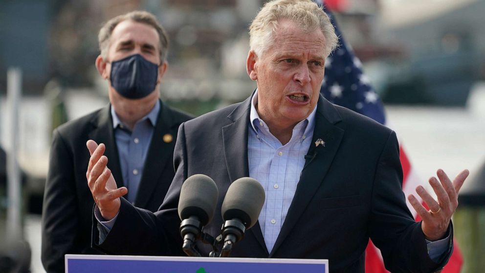 PHOTO: Former Virginia Gov. Terry McAuliffe, right, gestures during a news conference with Virginia Gov. Ralph Northam, left, at Waterside in Norfolk, Va., April 8, 2021.