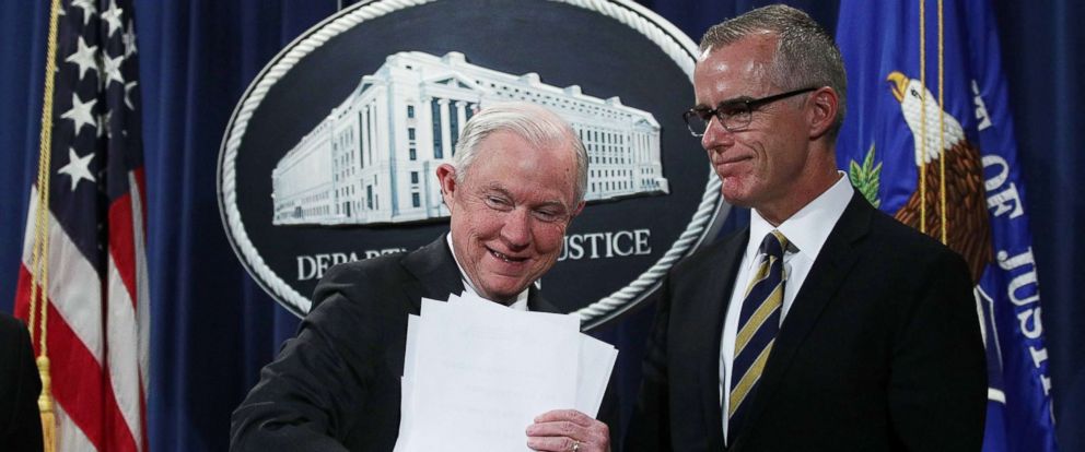 PHOTO: U.S. Attorney General Jeff Sessions picks up his remarks as Acting FBI Director Andrew McCabe looks on during a news conference at the Justice Department in Washington, July 13, 2017.