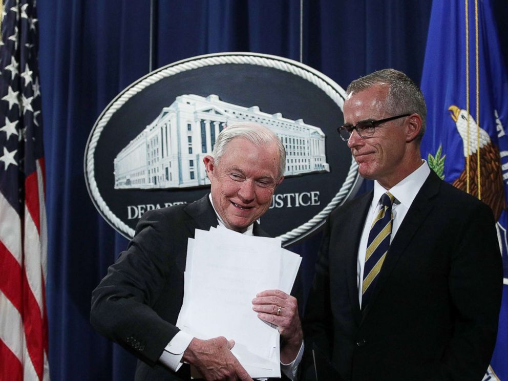 PHOTO: U.S. Attorney General Jeff Sessions picks up his remarks as Acting FBI Director Andrew McCabe looks on during a news conference at the Justice Department in Washington, July 13, 2017.