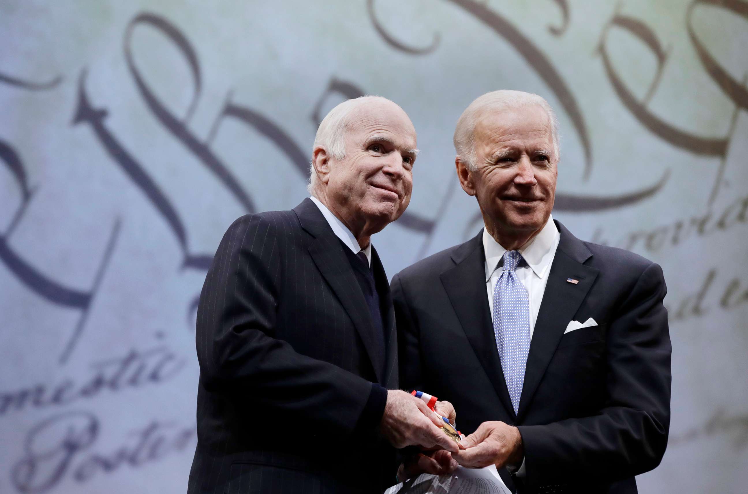 PHOTO: Sen. John McCain receives the Liberty Medal from Chair of the National Constitution Center's Board of Trustees, former Vice President Joe Biden, Oct. 16, 2017, in Philadelphia.