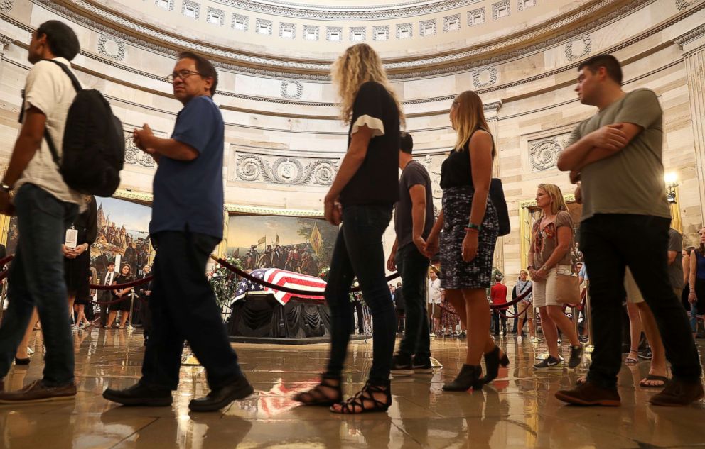 PHOTO: Members of the public file through the Rotunda to pay their respects to the late-Sen. John McCain (R-AZ) as his casket lies in state during a memorial service at the Capitol, Aug. 31, 2018. 