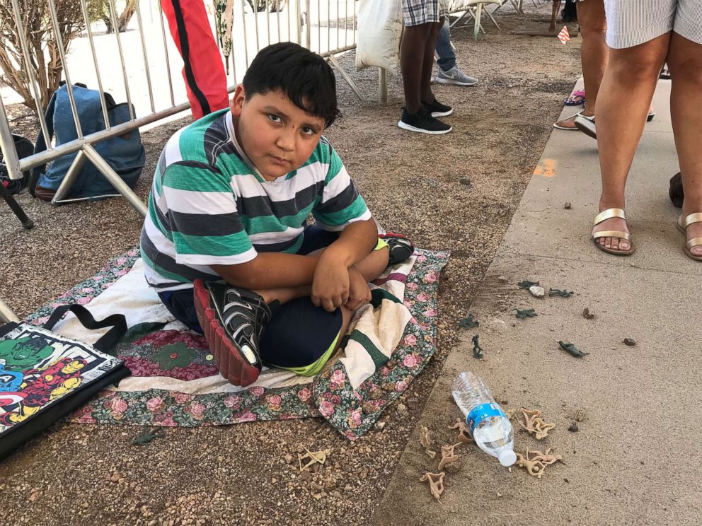 PHOTO: Kassandra Morales took her 8-year-old son Mathew, pictured playing with toy soldiers while waiting in line, because she wanted to show her kids "what a real hero is."