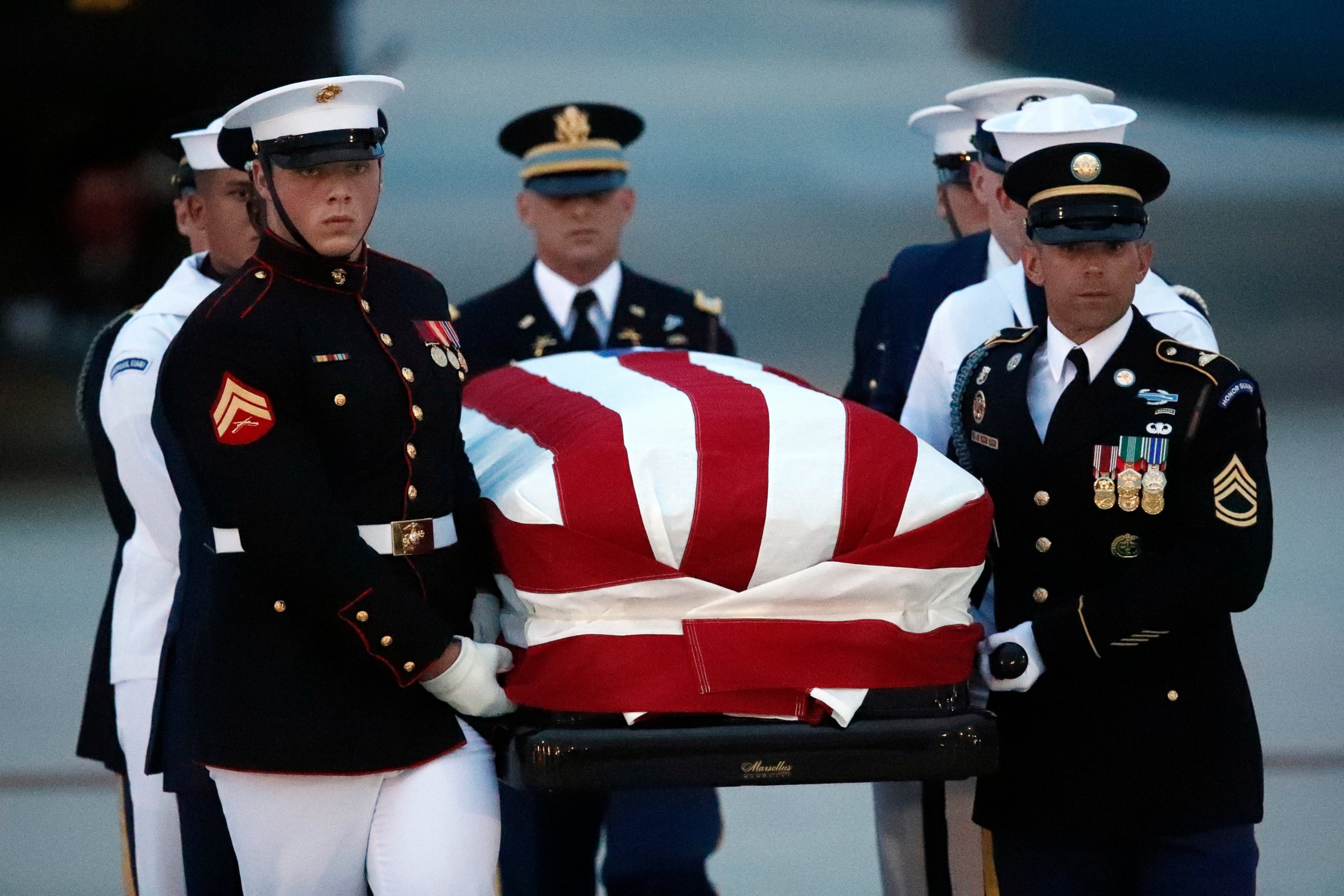 The flag-draped casket of Sen. John McCain, R-Ariz., is carried by an Armed Forces body bearer team to a hearse, Thursday, Aug. 30, 2018, at Andrews Air Force Base, Md.