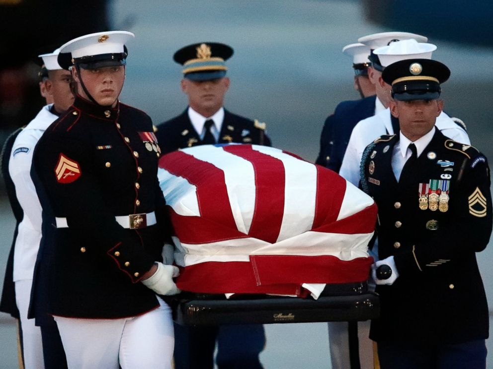 The flag-draped casket of Sen. John McCain, R-Ariz., is carried by an Armed Forces body bearer team to a hearse, Thursday, Aug. 30, 2018, at Andrews Air Force Base, Md.
