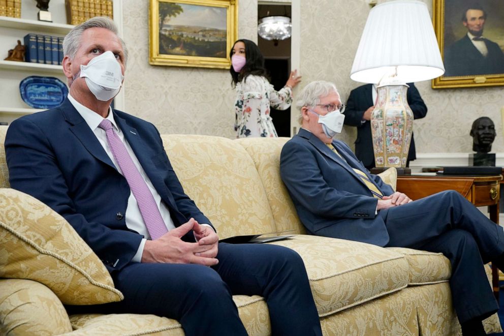 PHOTO: House Minority Leader Kevin McCarthy of Calif., left, and Senate Minority Leader Mitch McConnell of Ky., meet with President Joe Biden during a meeting with congressional leaders in the Oval Office, May 12, 2021, in Washington.