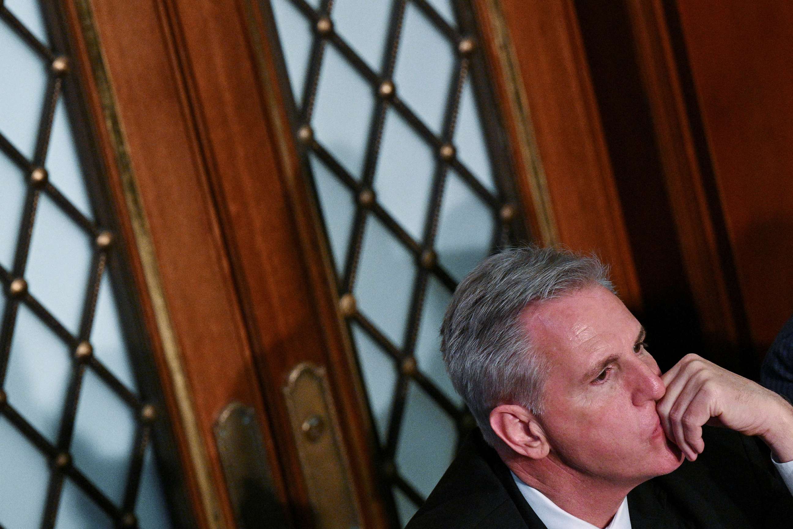PHOTO: House Republican Leader Kevin McCarthy watches from the back of the House Chamber as he loses a vote for Speaker of the House a sixth straight time on the second day of the 118th Congress at the U.S. Capitol in Washington, Jan. 4, 2023.