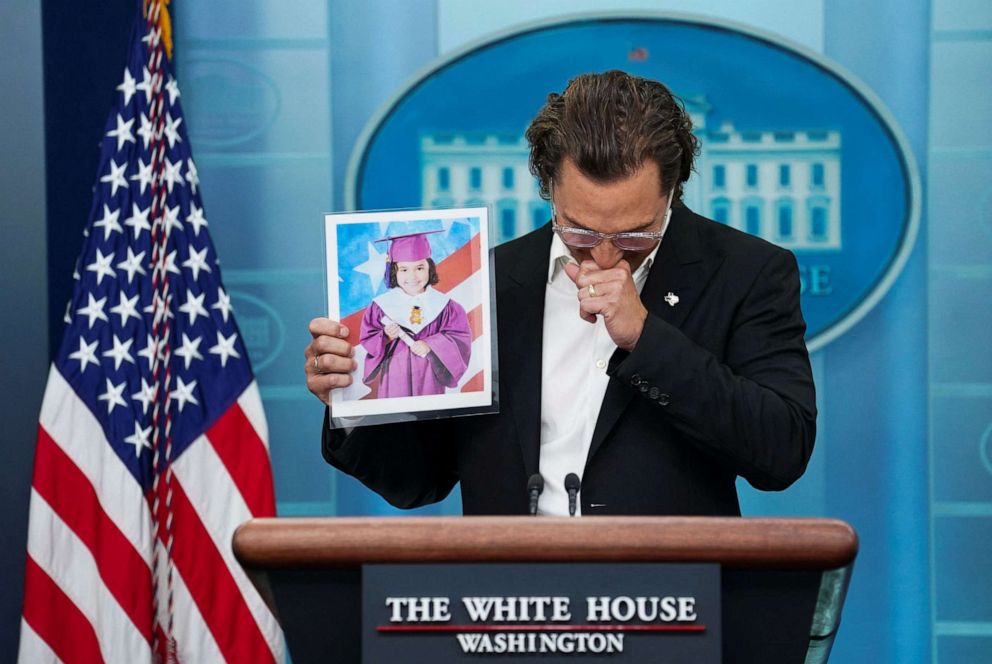 PHOTO: Matthew McConaughey becomes emotional as he holds up a photo of a young Uvalde school shooting victim as he speaks to reporters about mass shootings in the United States during a press conference at the White House, June 7, 2022.