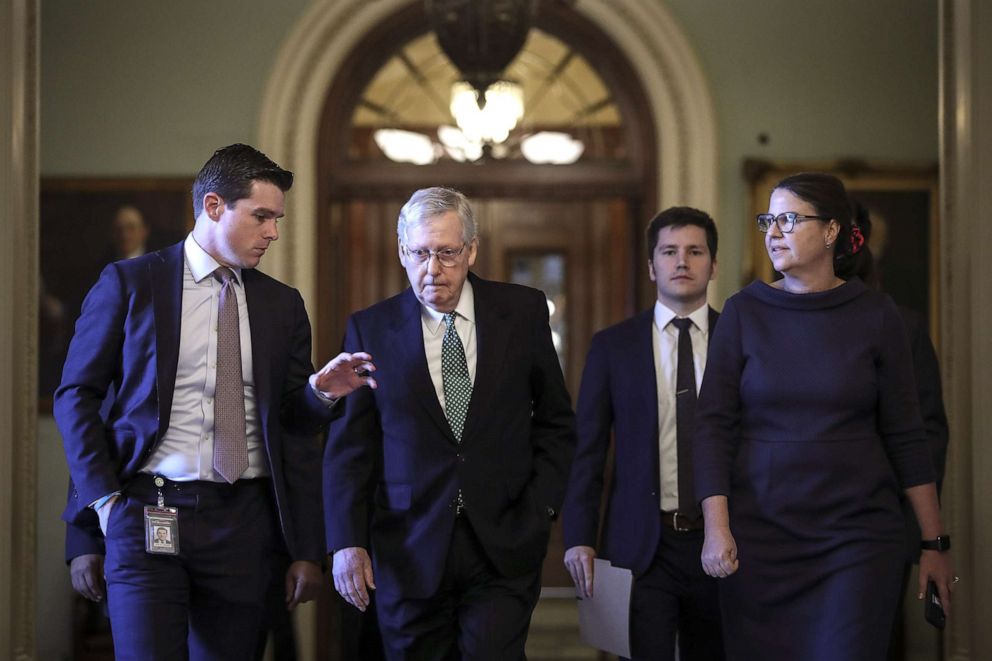 PHOTO: A reporter asks questions as Senate Majority Leader Mitch McConnell (R-KY) leaves the Senate floor and walks to his office at the Capitol, Jan. 8, 2020, in Washington, D.C. 