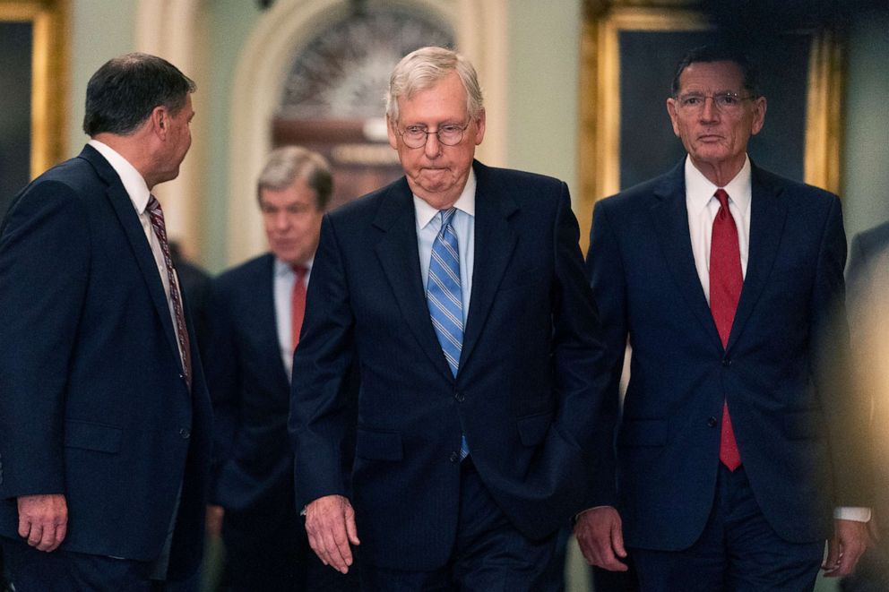 PHOTO: Senate Minority Leader Mitch McConnell walks to speak to reporters on Capitol Hill, Oct. 5, 2021. 