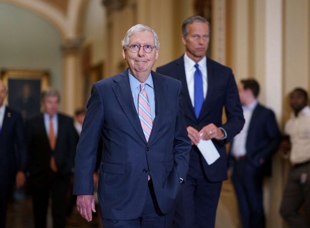 PHOTO: Senate Minority Leader Mitch McConnell, joined at right by Minority Whip John Thune, arrives to speak to reporters at the Capitol in Washington, July 13, 2021, following a weekly GOP strategy meeting.