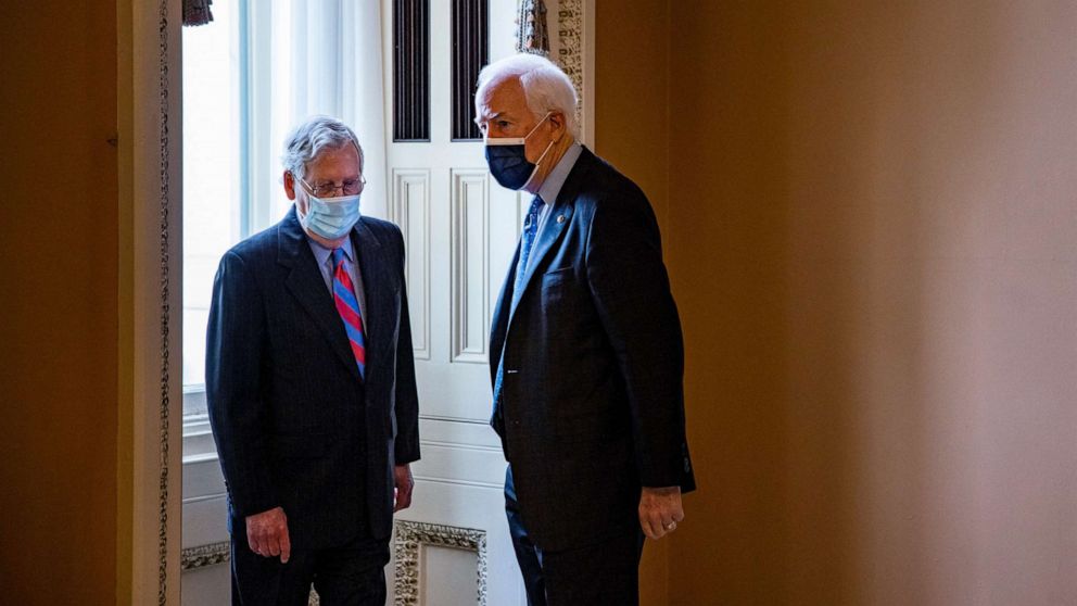PHOTO: Senate Minority Leader Mitch McConnell talks to Senator John Cornyn in a hallway on Capitol Hill in Washington, D.C., April 29, 2021.