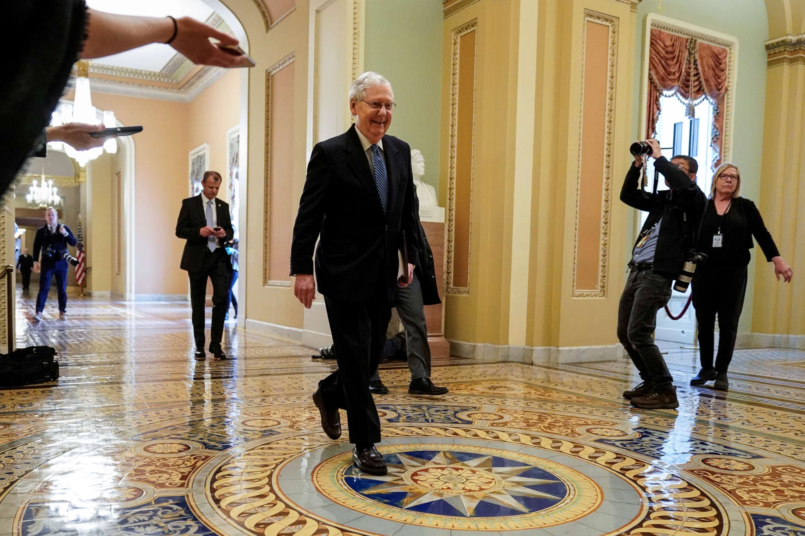 PHOTO: Senate Majority Leader Mitch McConnell arrives during negotiations on a coronavirus disease (COVID-19) relief package on Capitol in Washington, March 23, 2020.