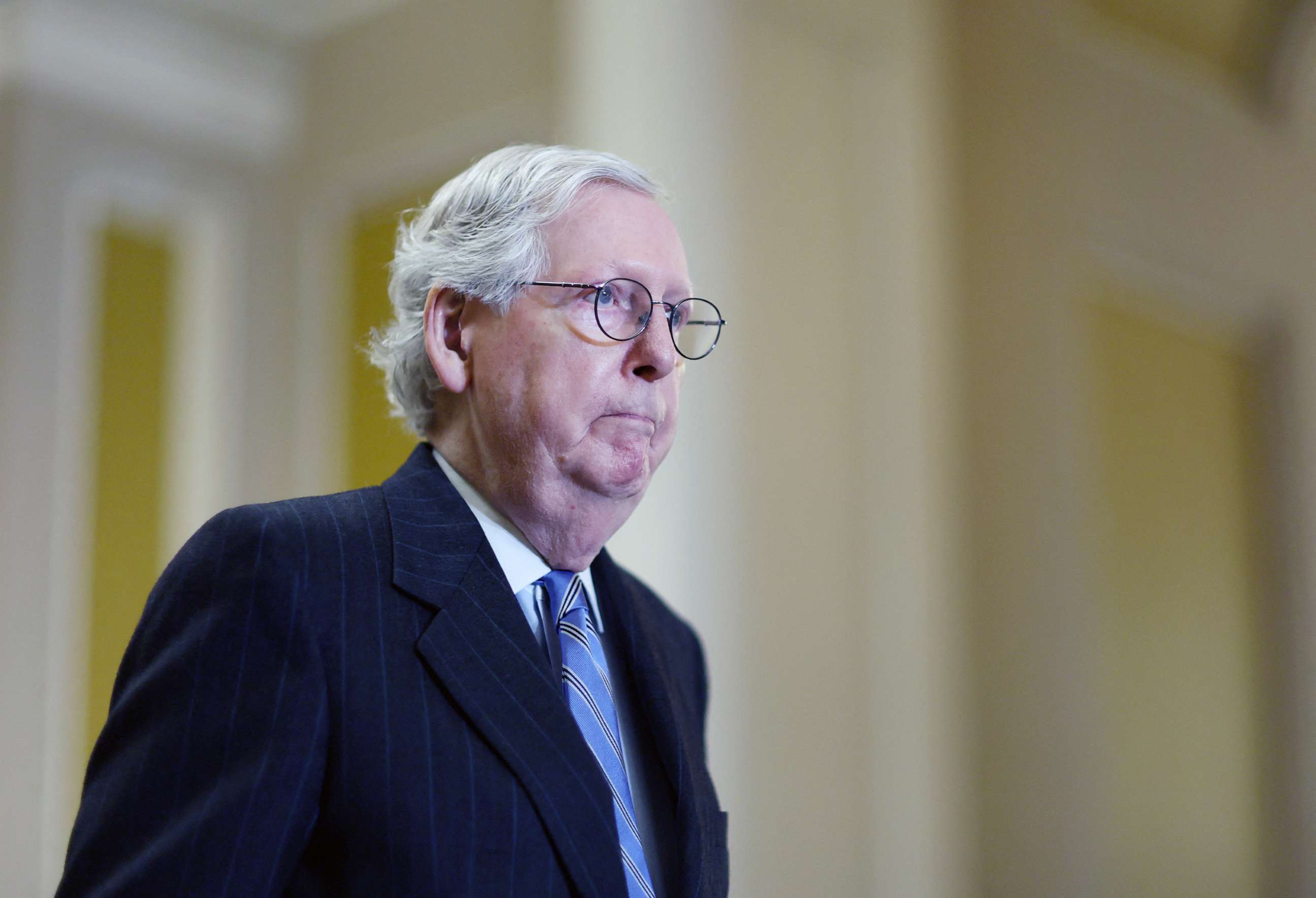 PHOTO: Senate Minority Leader Mitch McConnell approaches a podium for a weekly press conference in the U.S. Capitol building in Washington, Jan. 31, 2023.