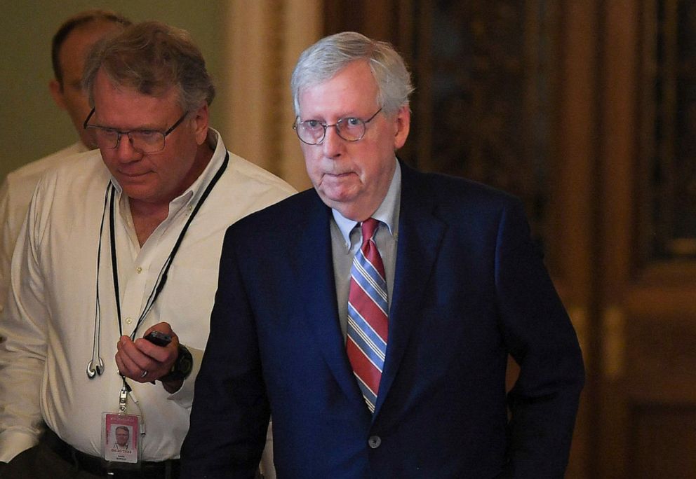 PHOTO: Senate Minority Leader Mitch McConnell walks past reporters at the U.S. Capitol in Washington, June 21, 2022.