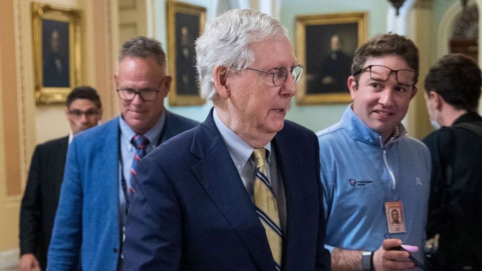 PHOTO: Senate Minority Leader Mitch McConnell responds to a question from the journalists as he walks to his office in the US Capitol in Washington, May 28, 2021.