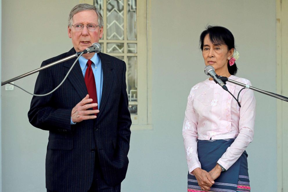 PHOTO: Senator Mitch McConnell addresses reporters following a meeting with Aung San Suu Kyi, right, at her residence in Yangon, Myanmar, Jan. 16, 2012.