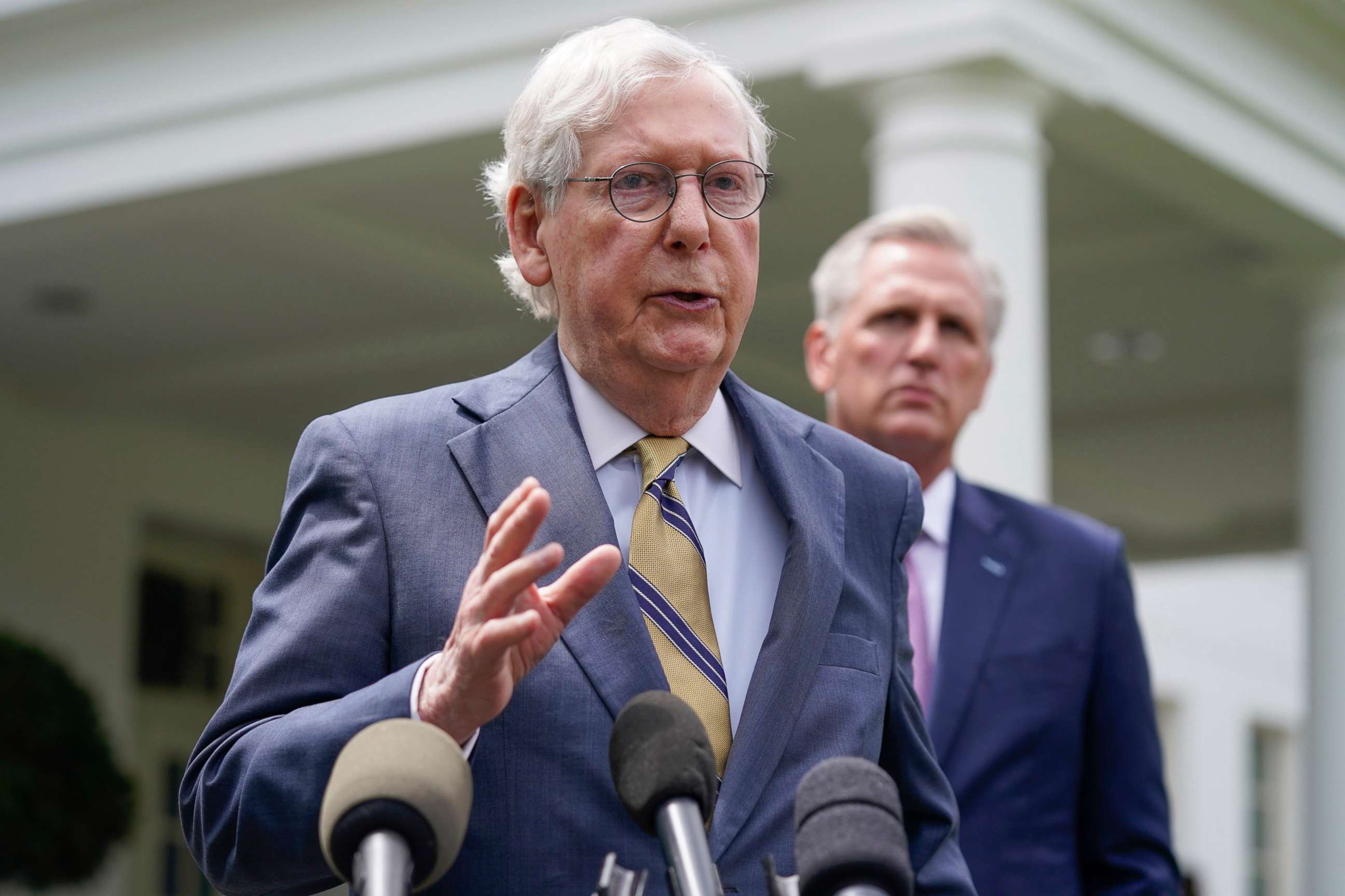 PHOTO: House Minority Leader Kevin McCarthy of Calif., right, listens as Senate Minority Leader Mitch McConnell of Ky., speaks to reporters outside the White House after a meeting with President Joe Biden, May 12, 2021, in Washington.