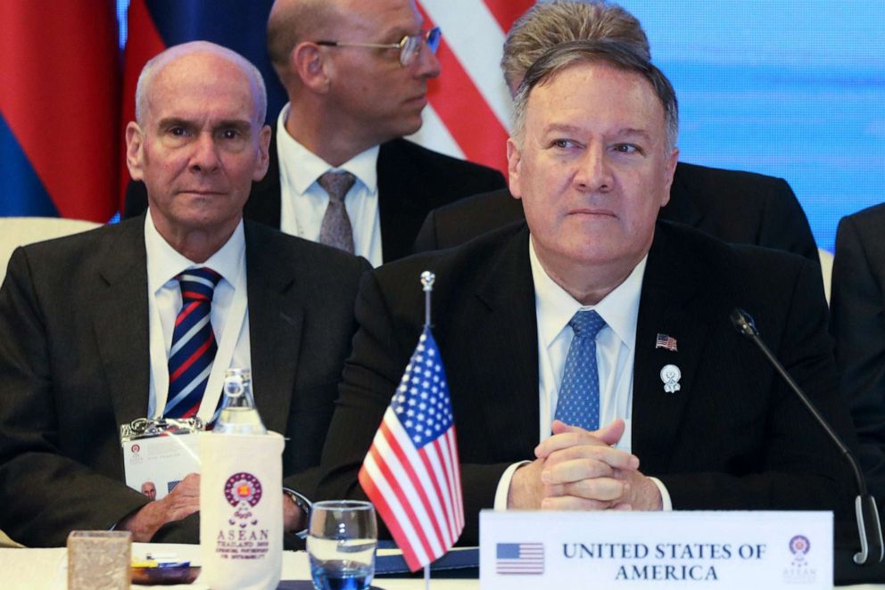 PHOTO: Former senior advisor Michael McKinley, left, sits behind Secretary of State Mike Pompeo during the ASEAN Foreign Ministers' Meeting in Bangkok, Thailand, Aug. 1, 2019.