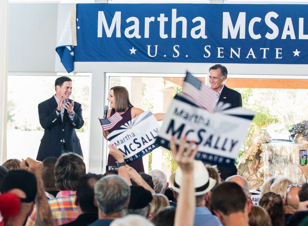 PHOTO: U.S. Rep. Martha McSally address her constituents along with Arizona Governor Doug Ducey, left, and Republican presidential nominee Mitt Romney, right, during a Get Out the Vote Rally, Oct. 12, 2018, in Gilbert, Ariz.