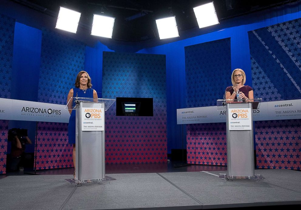 PHOTO: Republican Senate candidate Martha McSally and Democratic Senate candidate Kyrsten Sinema prepare to debate at the studios of a public television station in Phoenix, Oct. 15, 2018.