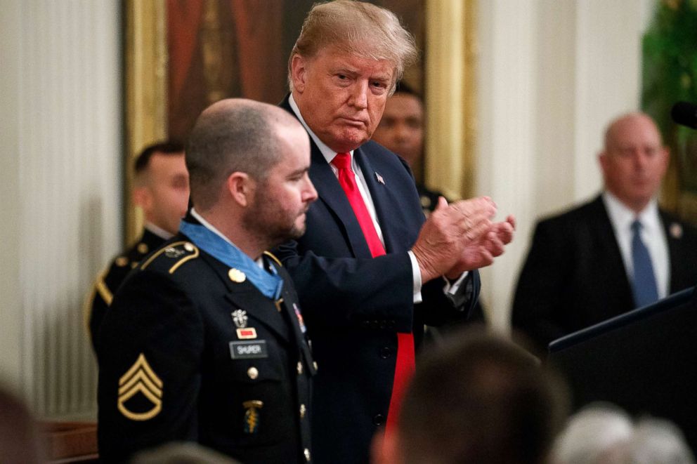 PHOTO: President Donald Trump applauds after handing the Congressional Medal to the former staff sergeant of the army. Ronald J. Shurer II for action in Afghanistan, in the East Room of the White House, October 1, 2018 in Washington.