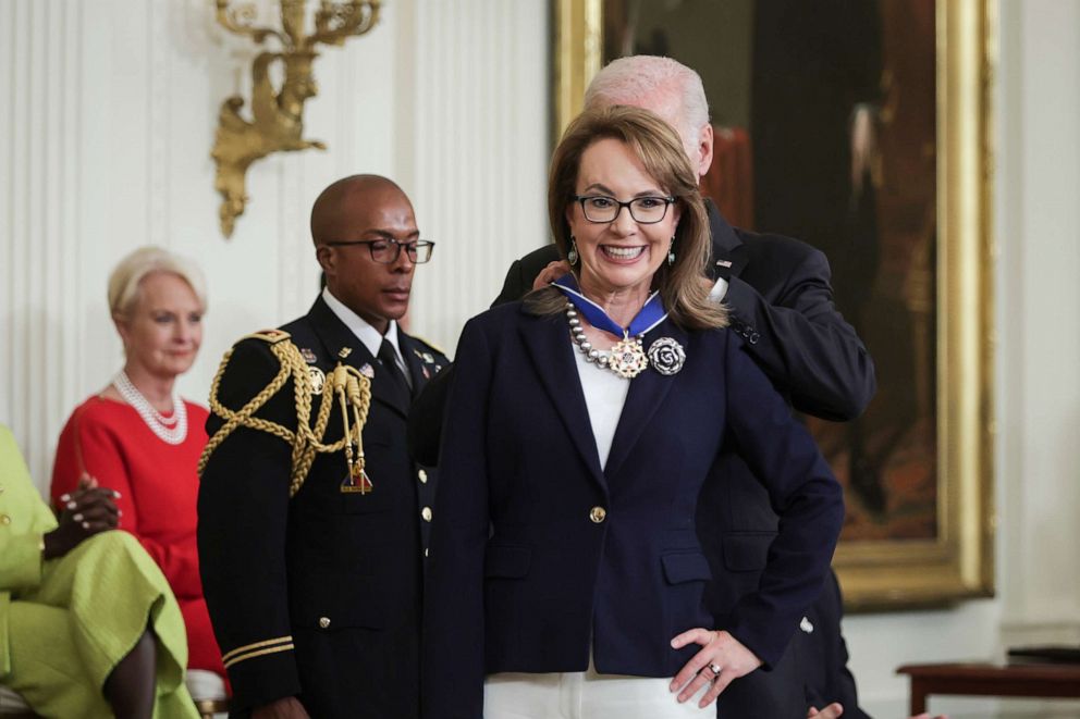 PHOTO: President Joe Biden presents the Presidential Medal of Freedom to gun control advocate and former Rep. Gabrielle Giffords during a ceremony in the East Room of the White House, July 7, 2022, in Washington, D.C.