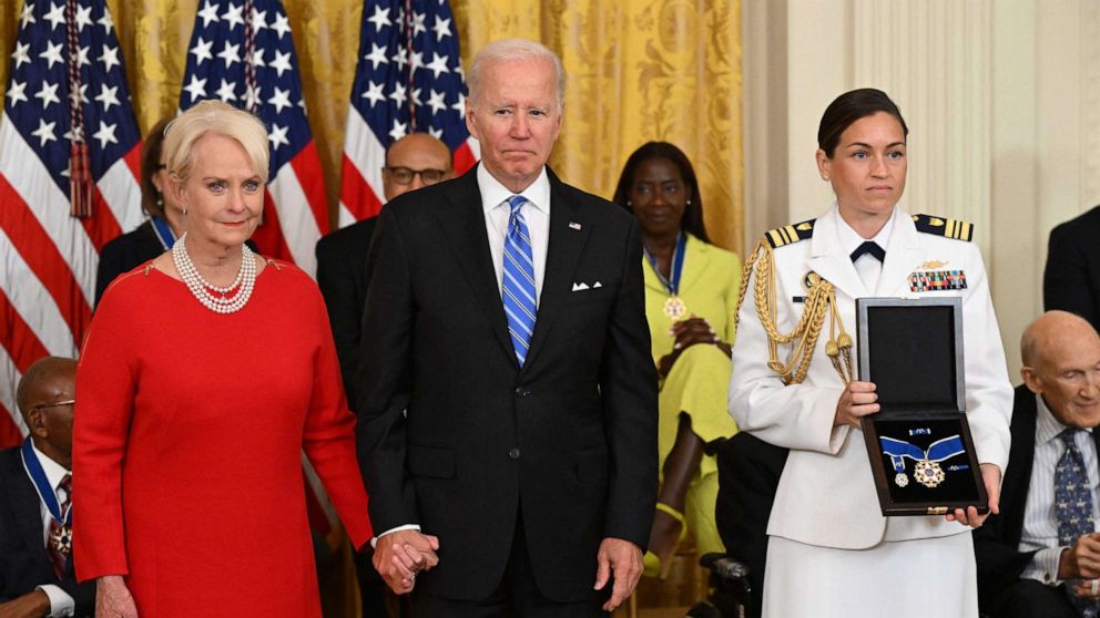PHOTO: US President Joe Biden presents Cindy McCain, the widow of former Senator and presidential candidate John McCain, posthumously with the Presidential Medal of Freedom, during a ceremony at the White House in Washington, D.C., July 7, 2022.