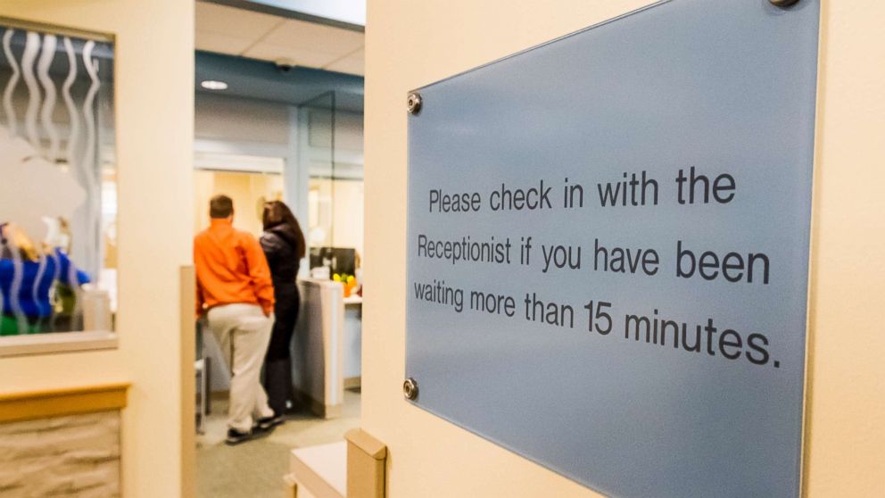 PHOTO: People stand in the reception area of a health care provider in Maine, Jan. 20, 2016.