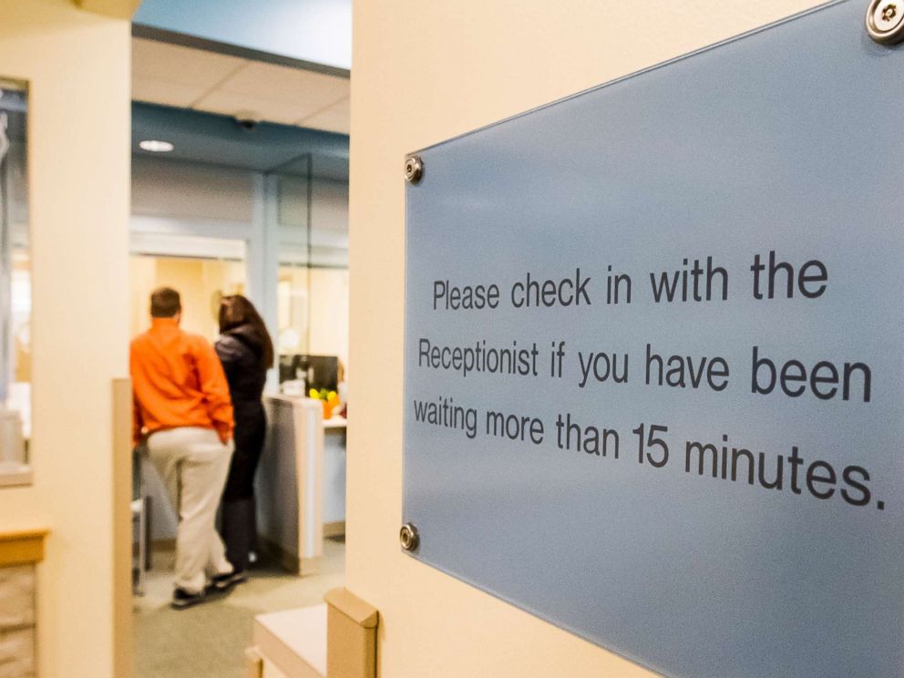PHOTO: People stand in the reception area of a health care provider in Maine, Jan. 20, 2016.