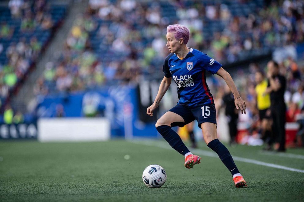 PHOTO: In this Aug. 29, 2021, file photo, Megan Rapinoe of the OL Reign looks for a pass during a game between Portland Thorns FC and OL Reign at Lumen Field in Seattle.