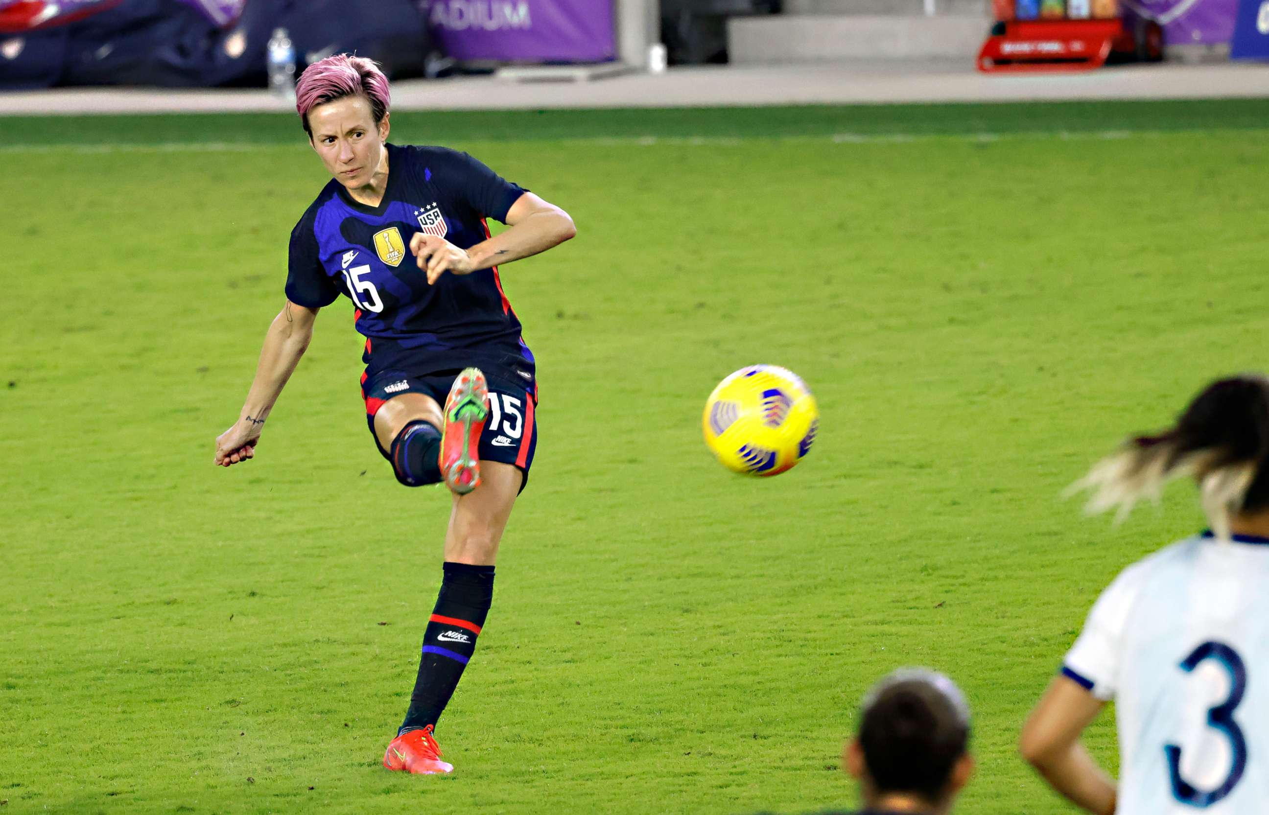 PHOTO: Megan Rapinoe kicks the ball during the second half of a She Believes Cup soccer match against Argentina at Exploria Stadium in Orlando, Fla., Feb. 24, 2021.