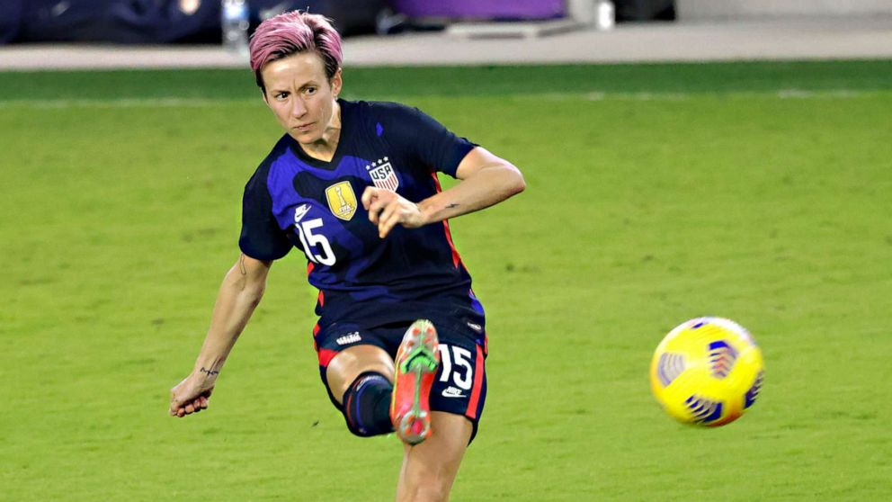 PHOTO: Megan Rapinoe kicks the ball during the second half of a She Believes Cup soccer match against Argentina at Exploria Stadium in Orlando, Fla., Feb. 24, 2021.