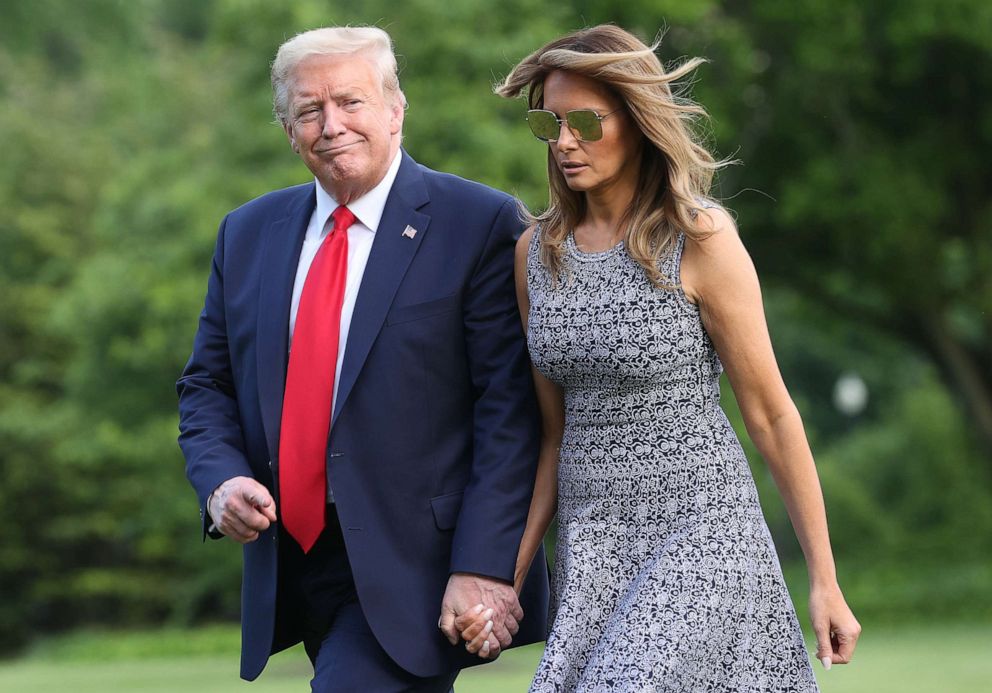 PHOTO: President Donald Trump and first lady Melania Trump return to the White House on May 27, 2020 in Washington.