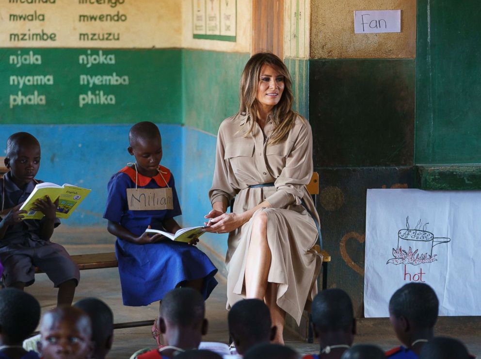 PHOTO: First lady Melania Trump helps a student as she visits a language class at Chipala Primary School, in Lilongwe, Malawi, Oct. 4, 2018.