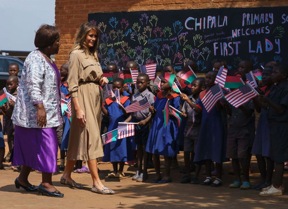 PHOTO: First lady Melania Trump is escorted by head teacher Maureen Masi as she arrives for a visit to Chipala Primary School, in Lilongwe, Malawi, Oct. 4, 2018.