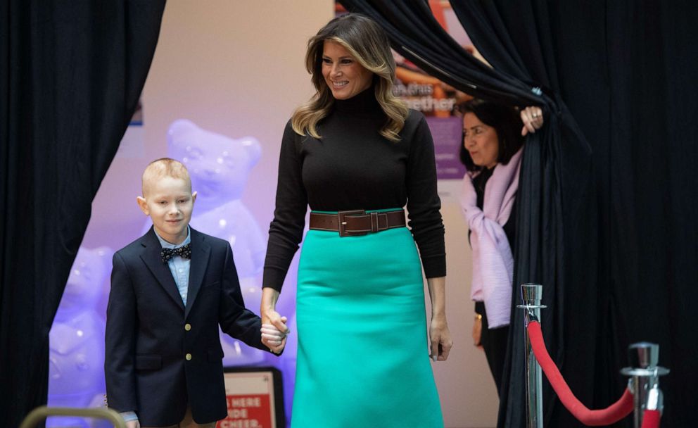 PHOTO: First lady Melania Trump arrives to read the book, "Oliver the Ornament Meets Belle", with patient Declan McCahan, during a visit to Children's National Hospital in Washington, Dec. 6, 2019.