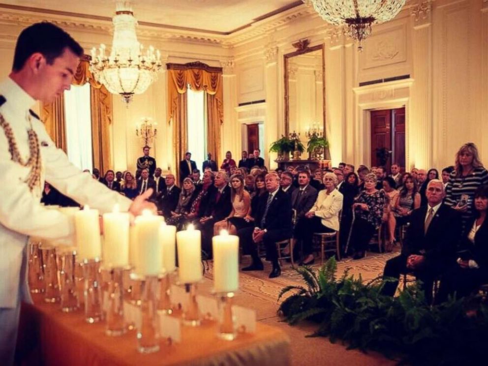 Melania Trump, center, with President Donald Trump, attended her first public event since kidney surgery at a reception honoring Iraq War victims on Monday, June 4, 2018.