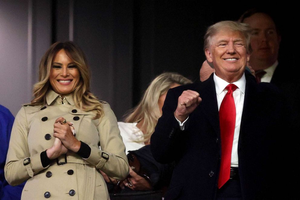 PHOTO: Former first lady  Melania and former president Donald Trump look on prior to Game Four of the World Series between the Houston Astros and the Atlanta Braves in Atlanta,  Oct. 30, 2021.