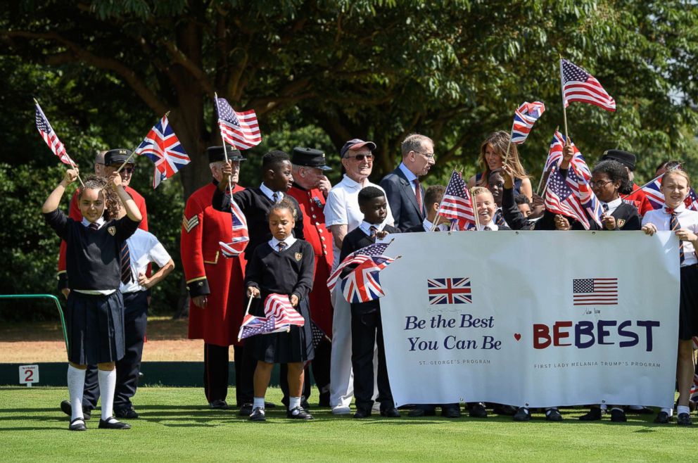 PHOTO: First lady Melania Trump stands with school children as she meets British Army veterans at Royal Hospital Chelsea on July 13, 2018 in London.