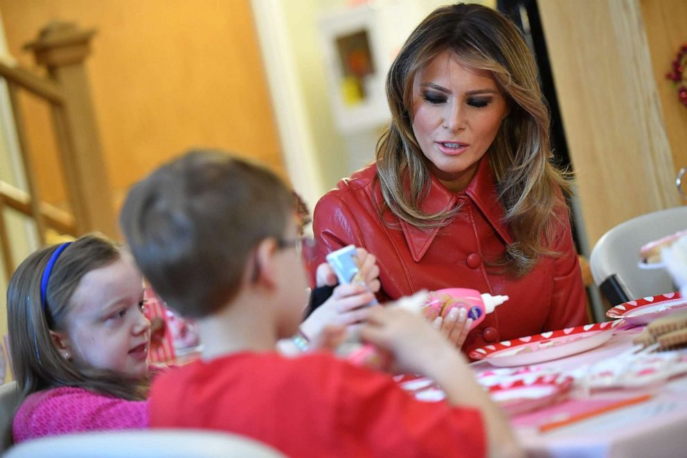 PHOTO: First lady Melania Trump decorates cookies for Valentine's Day as she visits with children at The Children's Inn at NIH in Bethesda, Md., Feb. 14, 2020.