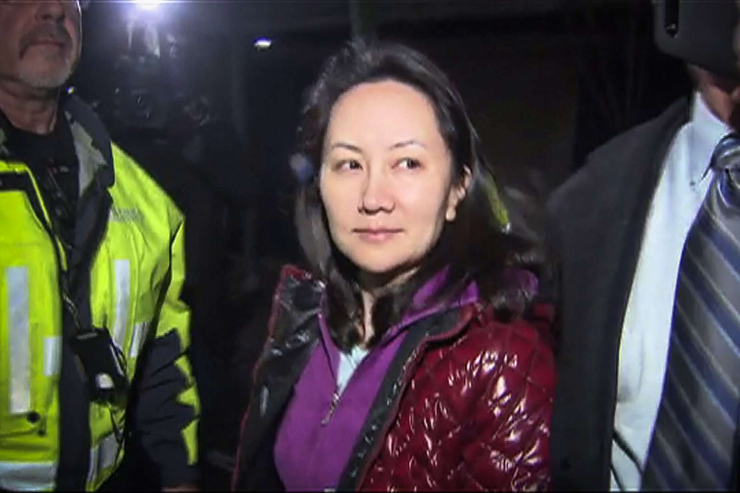 PHOTO: This TV image provided by CTV to AFP shows Huawei Technologies Chief Financial Officer Meng Wanzhou as she exits the court registry following the bail hearing at British Columbia Superior Courts in Vancouver, British Columbia, Dec. 11, 2018. 