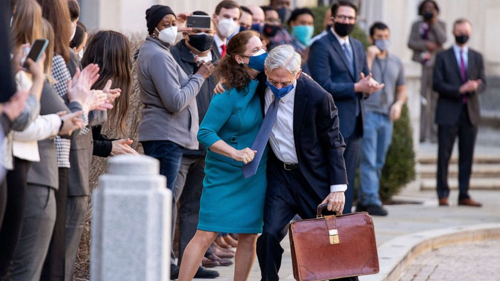 PHOTO: Newly confirmed U.S. Attorney General Merrick Garland hugs his wife Lynn as he arrives for his first day at the Department of Justice in Washington, D.C., March 11, 2021.