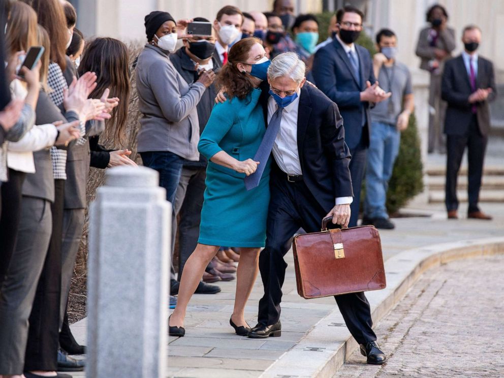 PHOTO: Newly confirmed U.S. Attorney General Merrick Garland hugs his wife Lynn as he arrives for his first day at the Department of Justice in Washington, D.C., March 11, 2021.