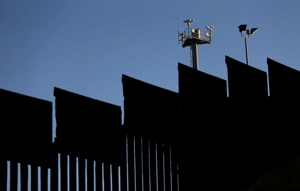PHOTO: Surveillance cameras stand above the U.S./Mexican border fence at Playas de Tijuana, Mexico, Jan. 27. 2017.