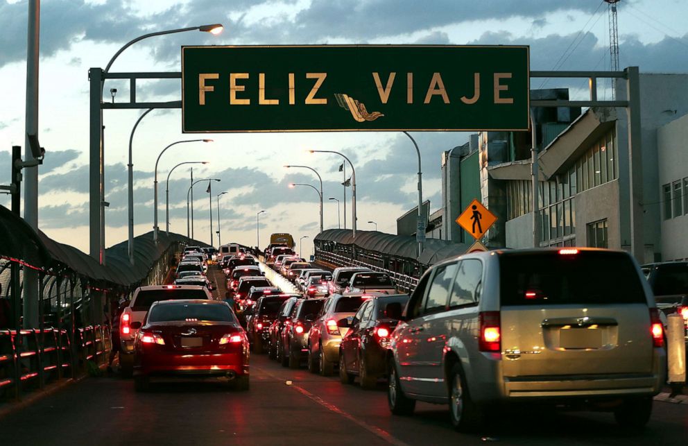 PHOTO: A sign reads, "happy travels" in Spanish as traffic heads towards the United States on the Paso Del Norte Port of Entry bridge, June 2, 2019, in Ciudad Juarez, Mexico.