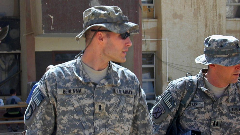 PHOTO: 1st Lt. Michael C. Behenna, left, and his defense attorney Capt. Tom Clark, right, walk in Camp Speicher north of Baghdad, Iraq, Sept. 21, 2008.