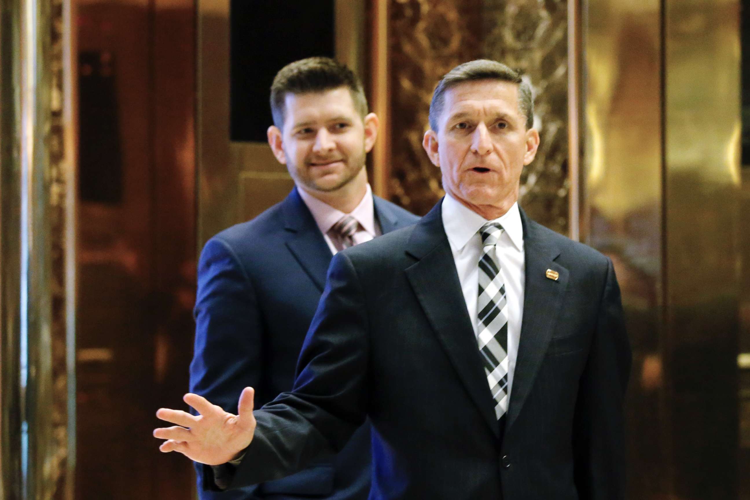 PHOTO: In this file photo dated Nov. 17, 2016, Michael Flynn Jr. is seen behind his father, retired Lt. Gen. Michael Flynn, as they arrive at Trump Tower in New York City.   